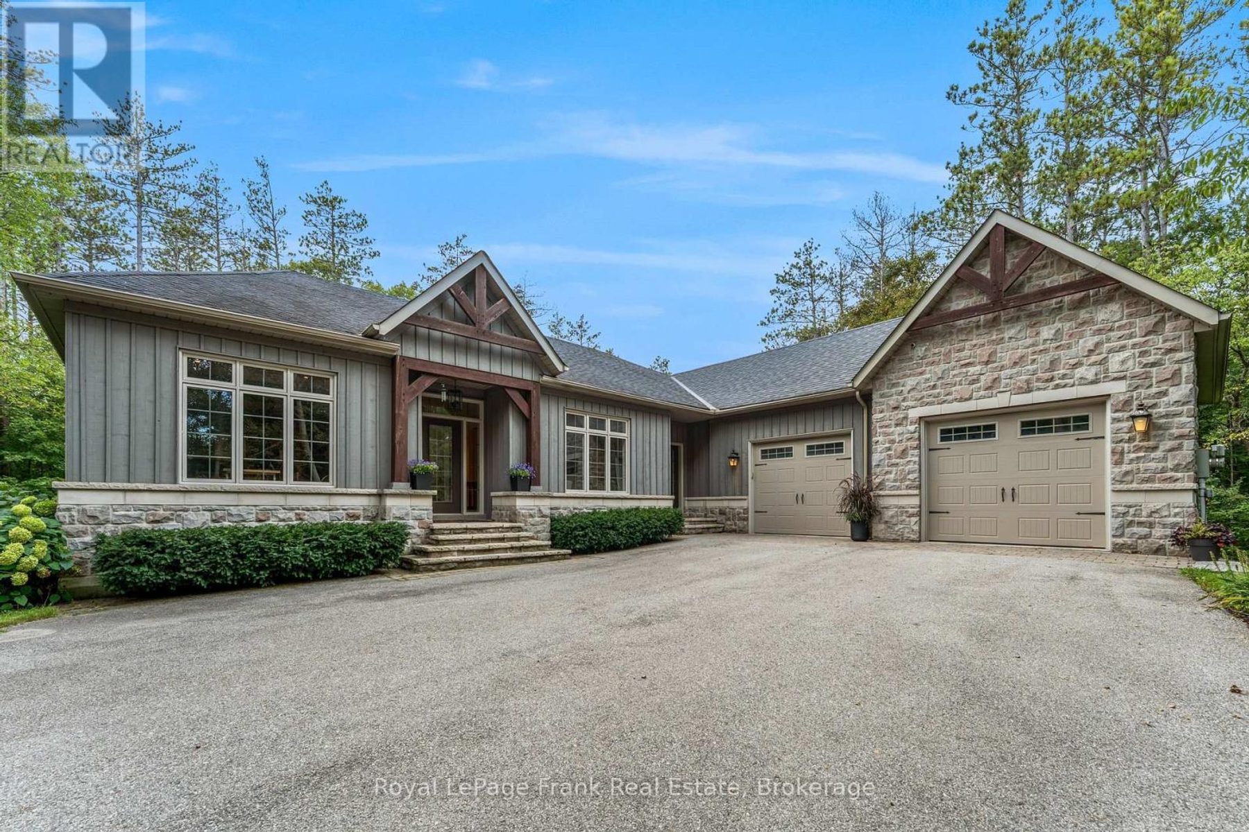860 Brookdale Rd, Uxbridge — custom stone and wood bungalow set among mature trees on 4 acres