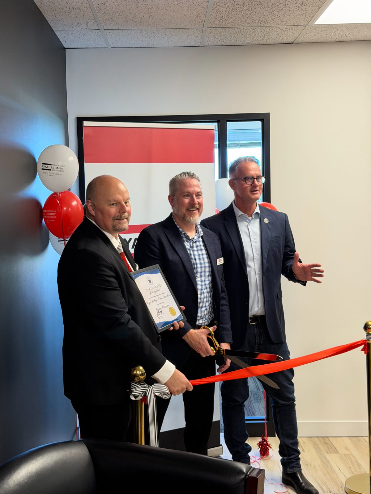 Ribbon cutting at the grand opening of Royal LePage Frank Real Estate in Stouffville